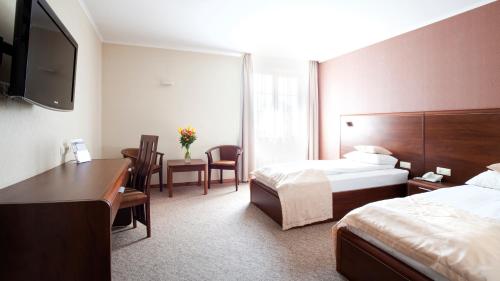 Artis Hotel & Spaにあるベッド