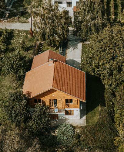 an overhead view of a house with a brown roof at Panoráma Faház Mohács in Mohács