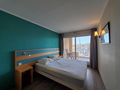 Posteľ alebo postele v izbe v ubytovaní CAP HERMES Vue PORT T2 40m2 climatise 4 personnes