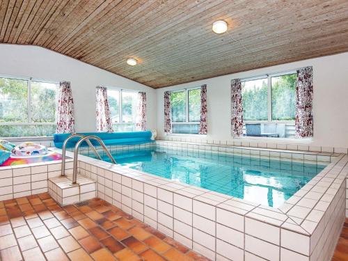 a large swimming pool in a house at 10 person holiday home in Glesborg in Fjellerup Strand