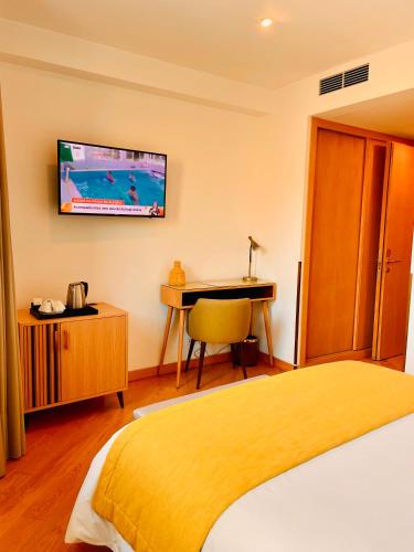 Giường trong phòng chung tại Castelo Hotel