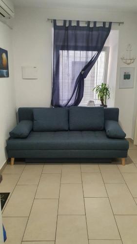 Coin salon dans l'établissement Apartment TIAN