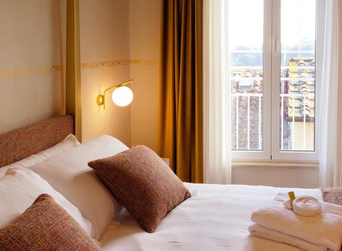 Letto o letti in una camera di PALAZZO ESSENZA