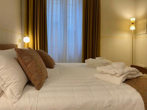 Letto o letti in una camera di PALAZZO ESSENZA