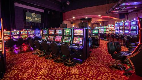 a casino filled with lots of slot machines at Mulino Luxury Boutique Hotel in Buje