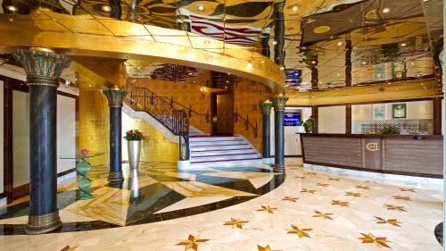 a lobby with a staircase in a building at Mulino Luxury Boutique Hotel in Buje