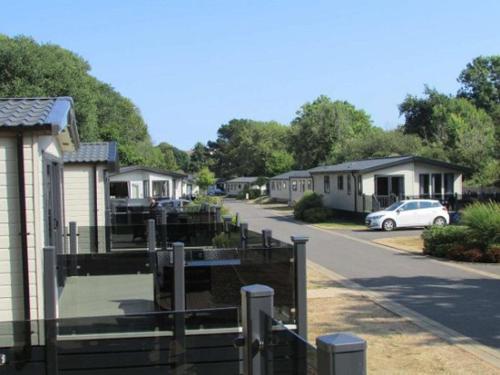 a row of houses with a car parked in the street at W16 in Paignton