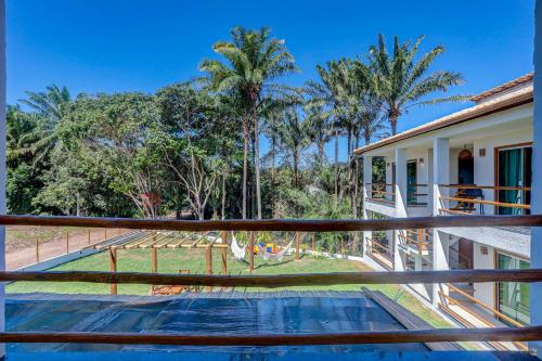 a view from the balcony of a house with trees at Pousada Céu & Mar de Taipu in Barra Grande