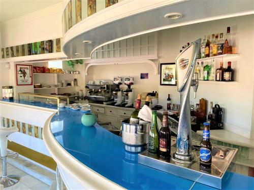 a kitchen with a blue counter top in a restaurant at Hotel Playamar Spa in Laredo