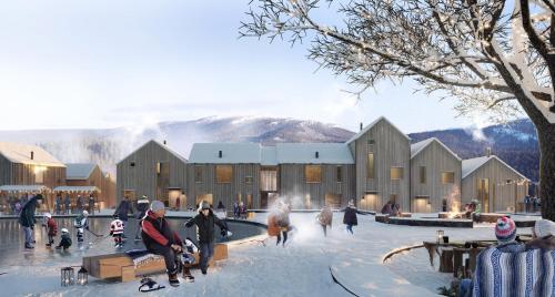 a group of people in the snow in front of a building at Viste Funäsdalen in Funäsdalen