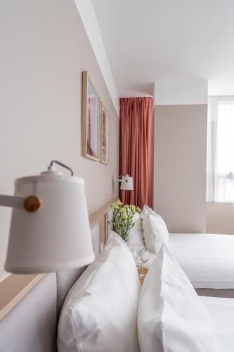 Hotel Altus Poznań Old Town - Destigo Hotelsにあるベッド