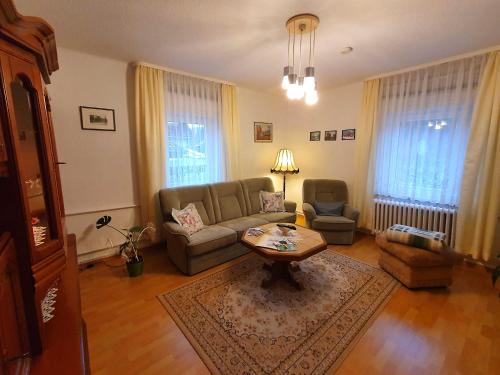 a living room with a couch and a coffee table at Ferienwohnung Walpurga in Elend