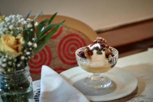 a dessert in a glass bowl on a table at Archontiko Deligianni in Dhimitsana