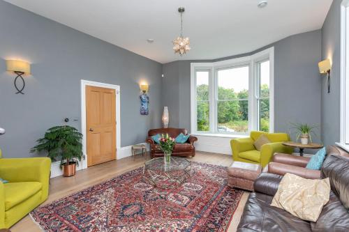 a living room with a couch and a table at The Wenning in High Bentham