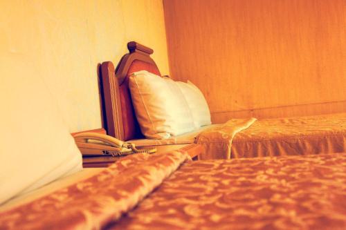 Postelja oz. postelje v sobi nastanitve Li Duo Hotel