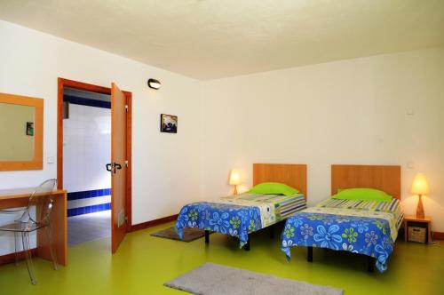 A bed or beds in a room at HI Castelo Branco - Pousada de Juventude