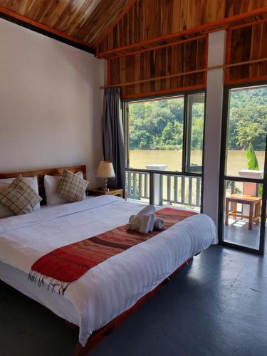 En eller flere senge i et værelse på Nam ou view villa