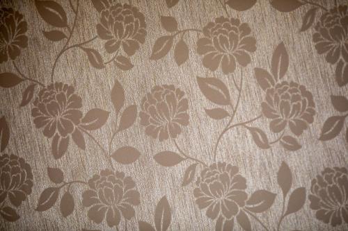 a wall with a flower pattern on it at OZO Hotels Cordial Amsterdam in Amsterdam