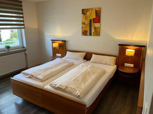 מיטה או מיטות בחדר ב-Hotel Carle