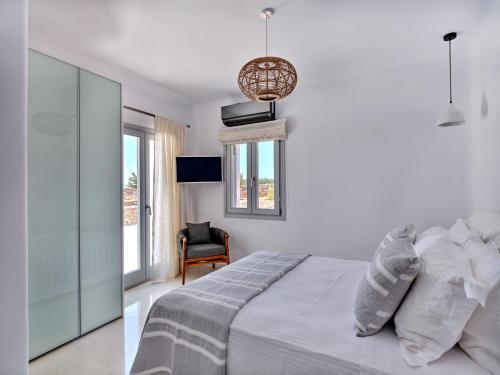 Ένα ή περισσότερα κρεβάτια σε δωμάτιο στο Costa Pounda Villas with private pools
