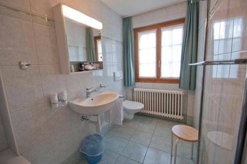 a bathroom with a sink and a toilet at Dent Blanche in Zermatt