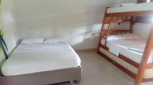 Кровать или кровати в номере Cabaña NEVERLAND