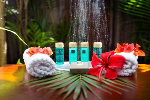 a table with two bottles of hair products on it at Tet Rouge Resort in Soufrière