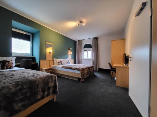 Postel nebo postele na pokoji v ubytování Hotel Kiepenkerl