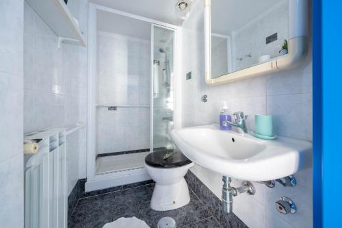 a bathroom with a sink and a toilet and a shower at Casa Roberta in Maiori