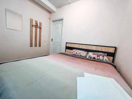 a bedroom with a large bed in a room at Guest House near Railway Station in Kyiv