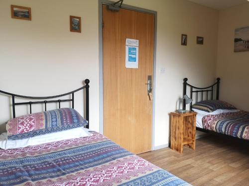 מיטה או מיטות בחדר ב-Anglesey Outdoors