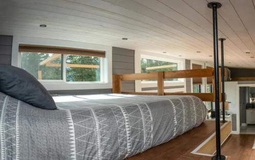 a bedroom with a bed in a room at Golden Tiny Homes in Golden