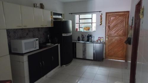 Η κουζίνα ή μικρή κουζίνα στο Casa para até 8 pessoas Garanhuns 4 quartos