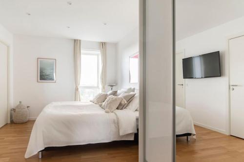 Una cama o camas en una habitación de Penthouse with amazing views of Copenhagen!MH74