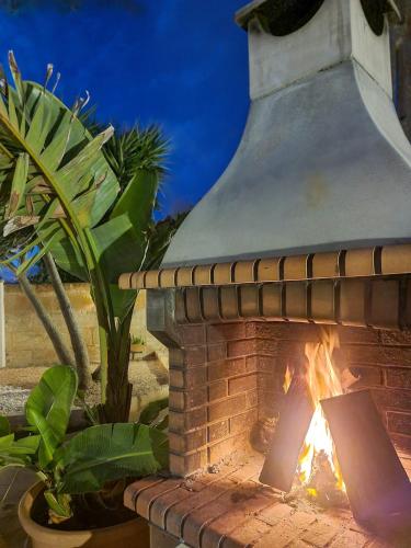 a brick oven with a fire in it at Eco Finca Sa Font Blava in Llucmajor