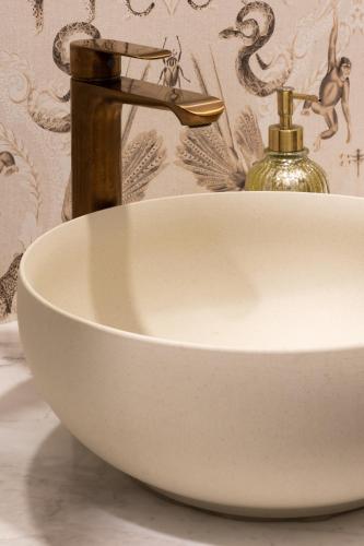a bathroom sink with a faucet and a sink at Tau House in Guatapé