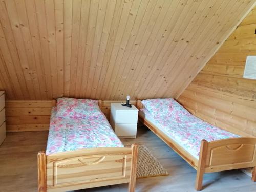 Postel nebo postele na pokoji v ubytování Agroturystyka Wudarsówka