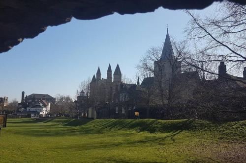 a large building with spires on a green field at Beautiful apartment in the heart of Rochester in Rochester