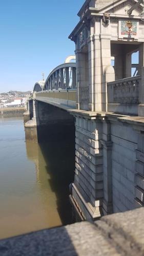 a bridge over a body of water with at Beautiful apartment in the heart of Rochester in Rochester