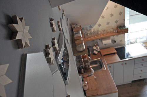 a kitchen with a refrigerator with stars on the wall at Studio Viline kose in Divčibare