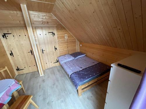 Postel nebo postele na pokoji v ubytování Agroturystyka Wudarsówka
