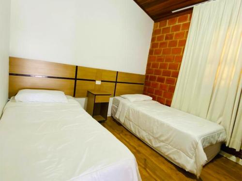 Postel nebo postele na pokoji v ubytování Paraty Hotel Fazenda & Spa