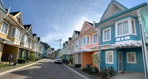 una fila de casas coloridas en una calle en 3 Bedrooms 3 Baths Victorian style Townhouse Fully Furnished, en Batangas