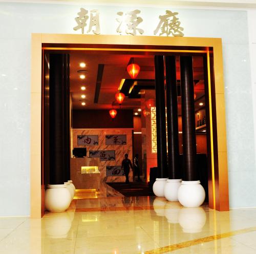 a lobby with a bunch of white vases in a building at Grand Riverview Hotel in Kota Bharu