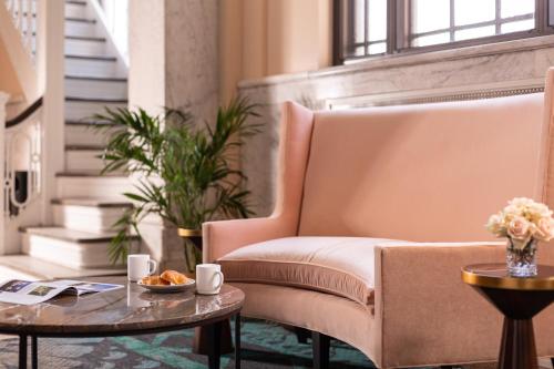 a living room with a chair and a table at The Liberty Trust in Roanoke