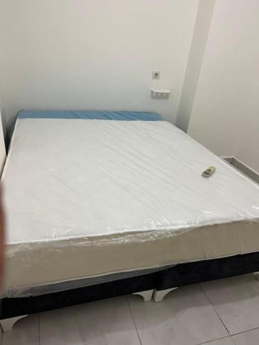 Postel nebo postele na pokoji v ubytování Merkezi Konumu ile mükemmel deneyim