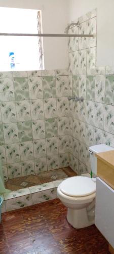 a bathroom with a toilet and a sink at Swiss Home 