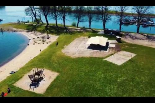 an aerial view of a park next to a beach at Luxus Chalet im schönen Recratiepark De Veerstal in Rheden