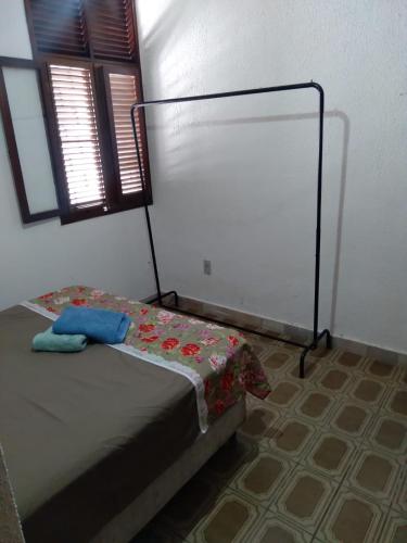 a bedroom with a bed in a room at Conceitual Hostel Natal in Natal
