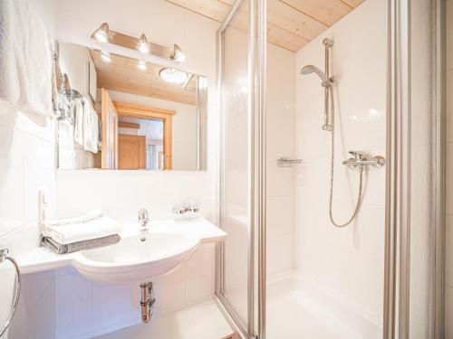a bathroom with a sink and a shower at Weberhof Top 2 in Brixen im Thale